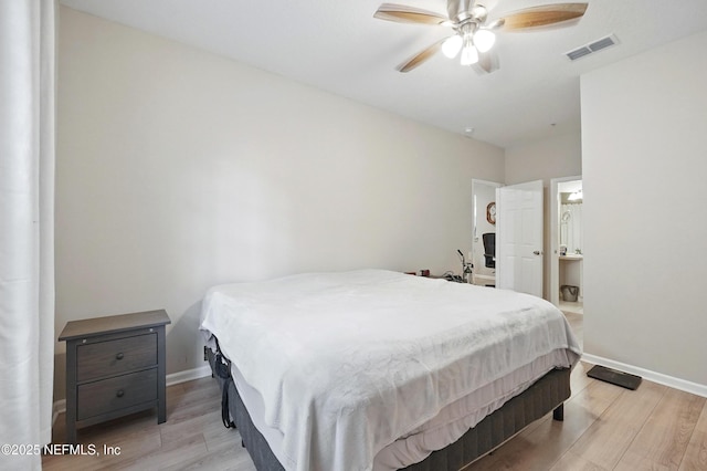 bedroom featuring visible vents, connected bathroom, light wood finished floors, and baseboards