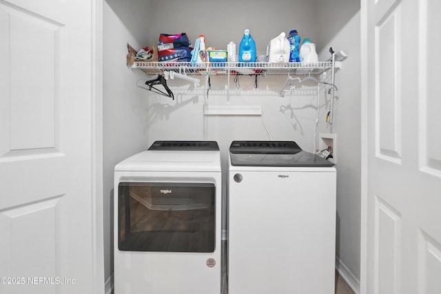 washroom featuring separate washer and dryer and laundry area