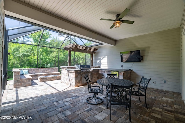 view of patio / terrace featuring a grill, outdoor dining area, area for grilling, and ceiling fan