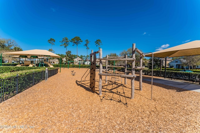 communal playground featuring fence