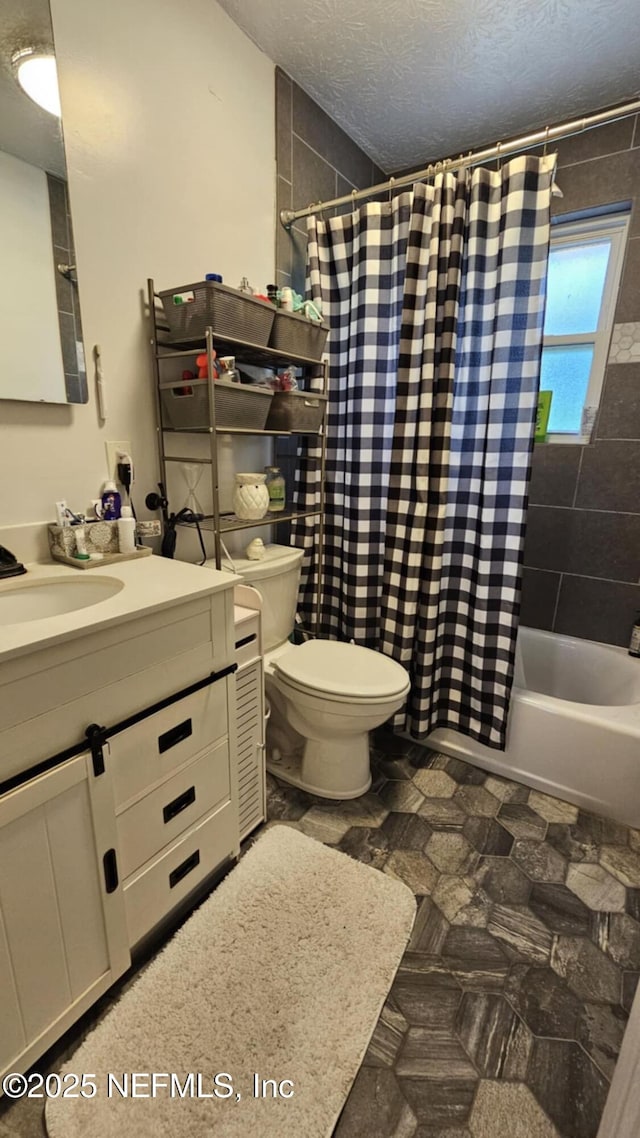 45116 Coquina Way, Callahan, FL 32011 - full bathroom with a textured ceiling, toilet, vanity, and shower / bath combo