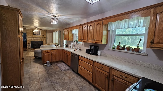 45116 Coquina Way, Callahan, FL 32011 - kitchen with dishwasher, ceiling fan, brown cabinetry, a sink, and a textured ceiling