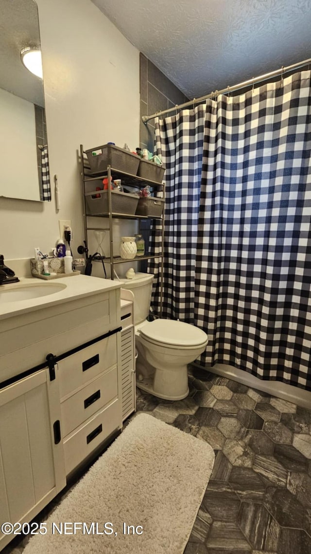 45116 Coquina Way, Callahan, FL 32011 - full bathroom featuring a textured ceiling, toilet, vanity, and a shower with curtain