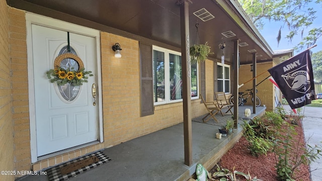 45116 Coquina Way, Callahan, FL 32011 - entrance to property featuring covered porch and brick siding