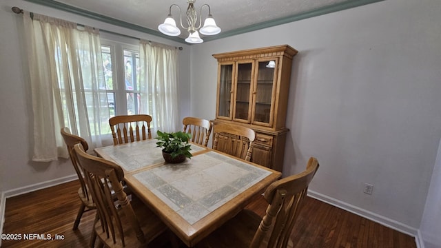 45116 Coquina Way, Callahan, FL 32011 - dining space with a chandelier, baseboards, and dark wood-style floors