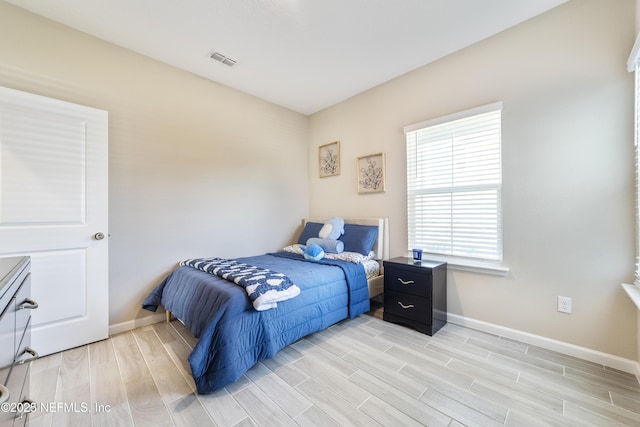2793 Pointed Leaf Rd, Green Cove Springs, FL 32043 - bedroom with baseboards, light wood-style floors, and visible vents
