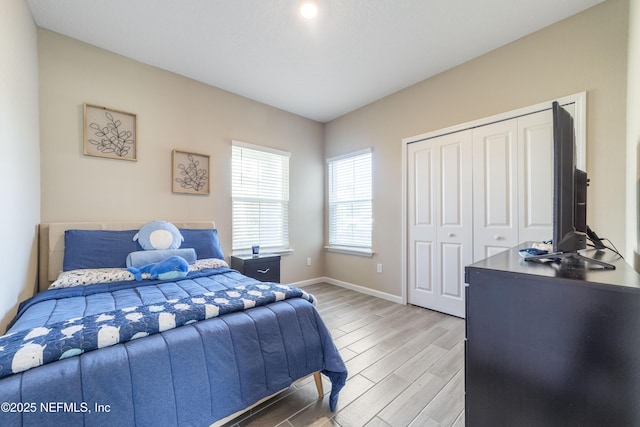 2793 Pointed Leaf Rd, Green Cove Springs, FL 32043 - bedroom with light wood-type flooring, baseboards, and a closet