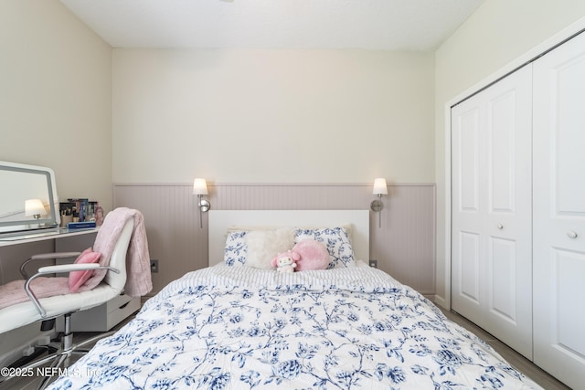 2793 Pointed Leaf Rd, Green Cove Springs, FL 32043 - bedroom featuring wainscoting, wood finished floors, and a closet
