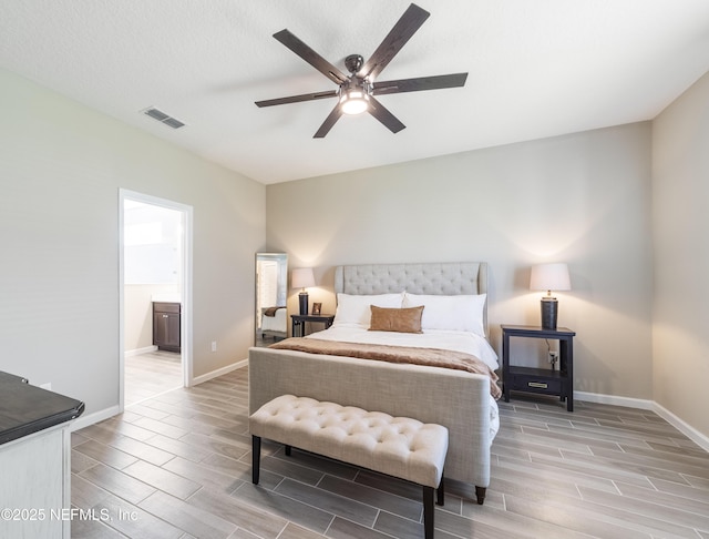 2793 Pointed Leaf Rd, Green Cove Springs, FL 32043 - bedroom featuring ensuite bath, wood finish floors, visible vents, and baseboards