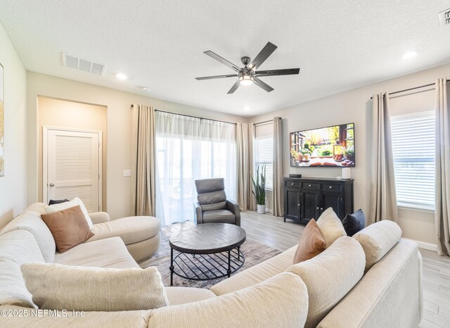 2793 Pointed Leaf Rd, Green Cove Springs, FL 32043 - living room featuring light wood finished floors, baseboards, visible vents, recessed lighting, and a ceiling fan