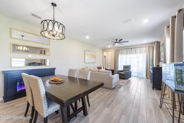 2793 Pointed Leaf Rd, Green Cove Springs, FL 32043 - dining space with recessed lighting, ceiling fan with notable chandelier, visible vents, and light wood-style flooring