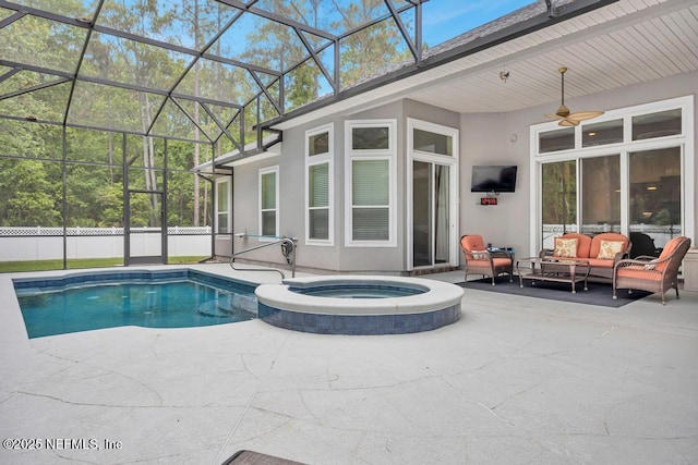 view of swimming pool featuring a ceiling fan, a pool with connected hot tub, a patio area, glass enclosure, and outdoor lounge area