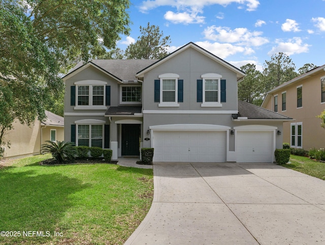 traditional-style house featuring a garage, a front lawn, stucco siding, a shingled roof, and driveway