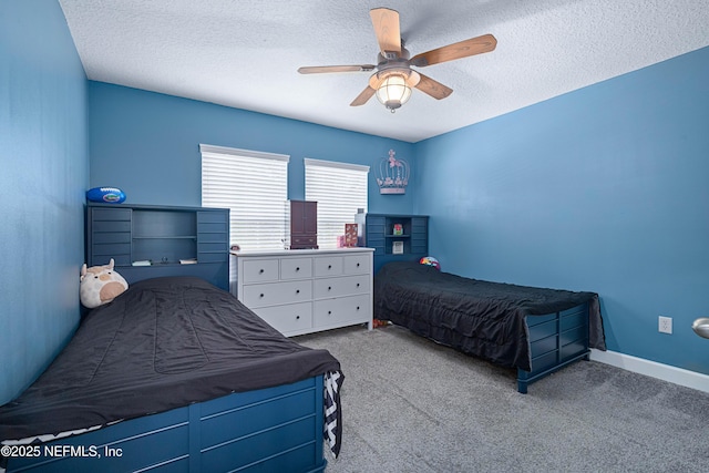 bedroom featuring carpet flooring, a textured ceiling, and ceiling fan