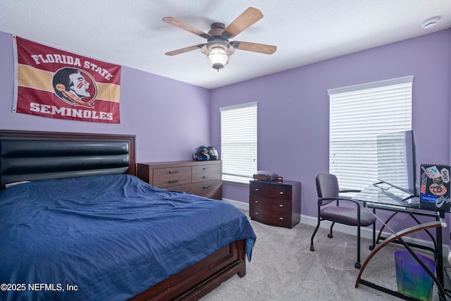 bedroom featuring carpet floors, a ceiling fan, and baseboards