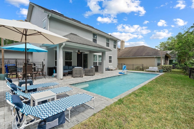back of house with a yard, fence, outdoor lounge area, and a ceiling fan