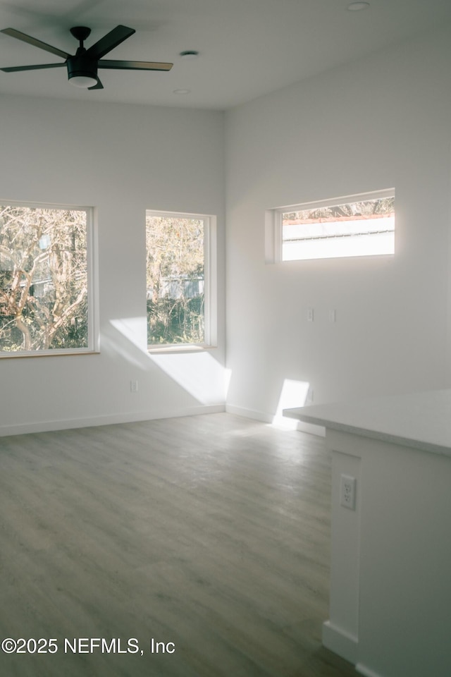 572 Woodlawn Rd, Saint Augustine, FL 32084 - empty room featuring ceiling fan, baseboards, and wood finished floors