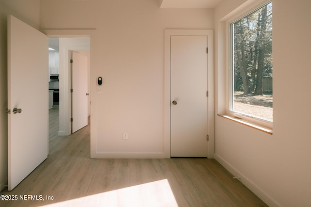 572 Woodlawn Rd, Saint Augustine, FL 32084 - interior space with light wood-style floors, baseboards, and multiple windows