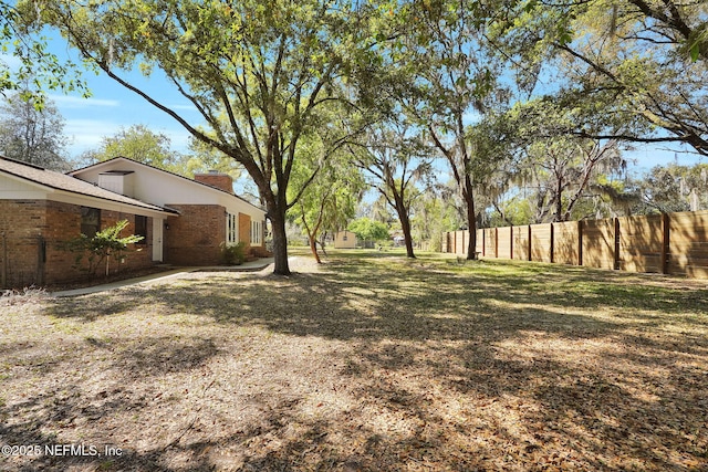 view of yard with fence