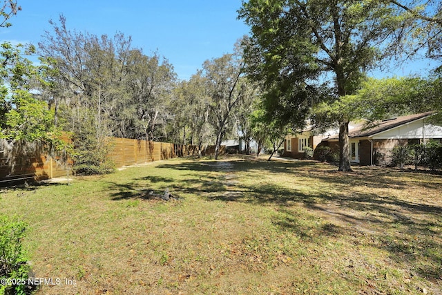 view of yard featuring fence