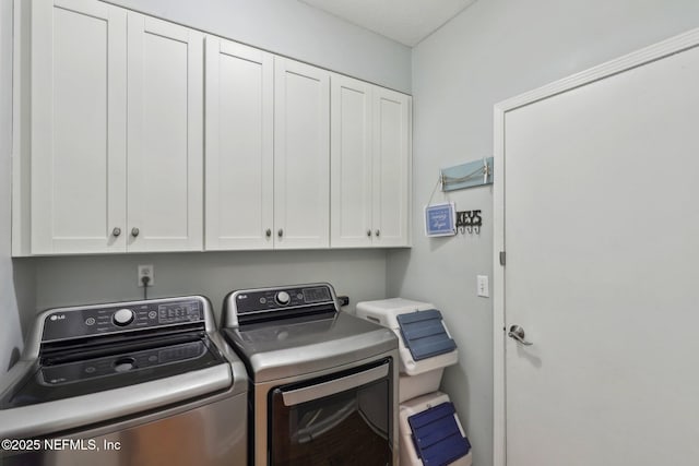 laundry room with cabinet space and independent washer and dryer