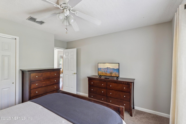 bedroom with visible vents, carpet flooring, baseboards, and a ceiling fan