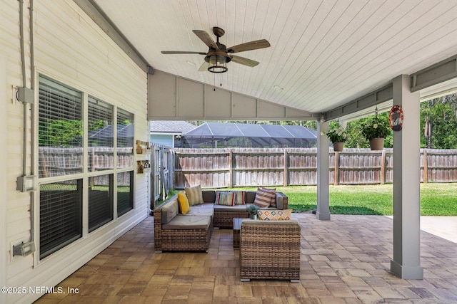 view of patio / terrace with a ceiling fan, a fenced backyard, and an outdoor hangout area
