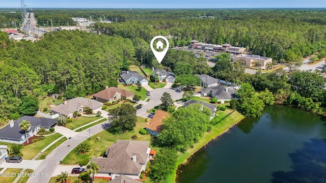 bird's eye view featuring a water view, a view of trees, and a residential view