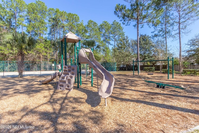 communal playground featuring fence