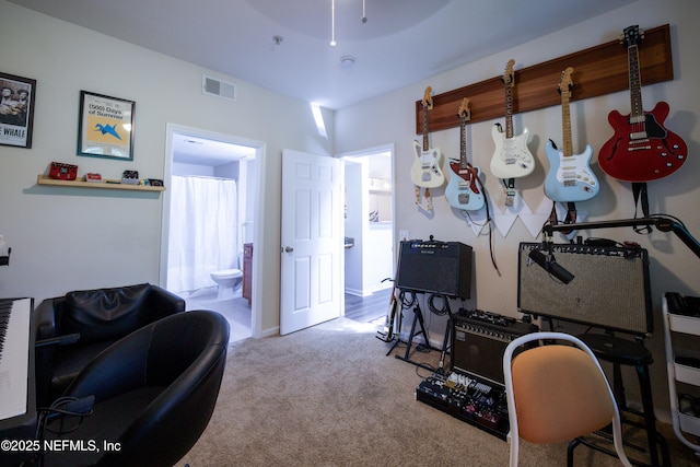 interior space featuring visible vents and carpet flooring