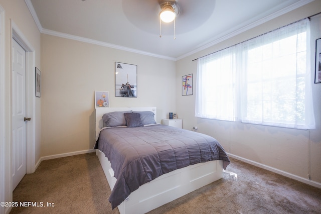 bedroom with baseboards, crown molding, and carpet