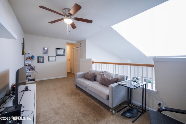 living area with carpet and a ceiling fan