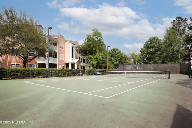 view of sport court featuring community basketball court and fence