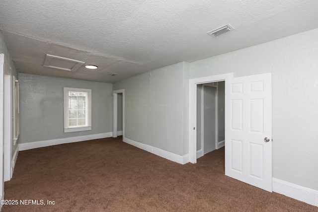 1488 W 5th St, Jacksonville, FL 32209 - carpeted spare room featuring attic access, baseboards, a textured ceiling, and visible vents