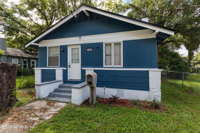 1488 W 5th St, Jacksonville, FL 32209 - bungalow-style home with fence, crawl space, and a front yard