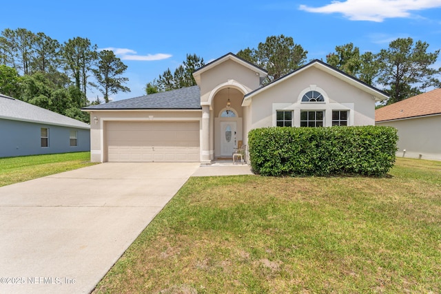 single story home with concrete driveway, a front lawn, a garage, and stucco siding
