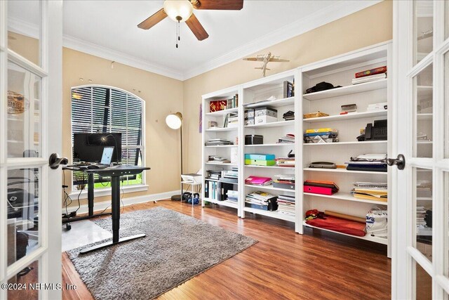 office area featuring wood finished floors, a ceiling fan, ornamental molding, and french doors