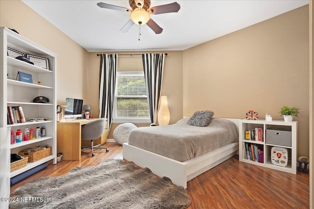 bedroom with a ceiling fan and wood finished floors
