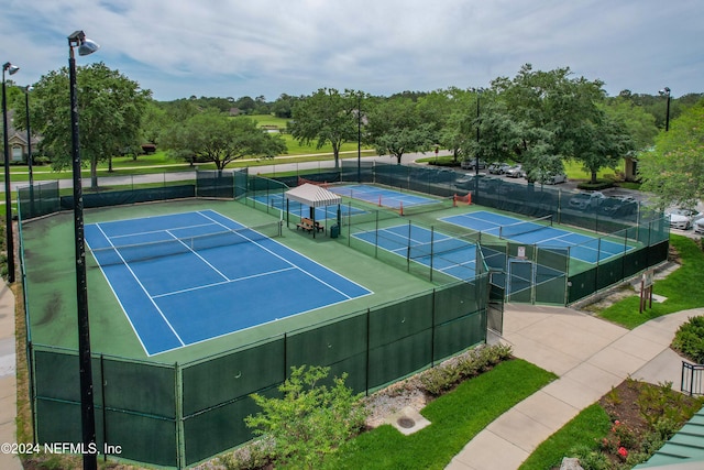 view of sport court featuring fence
