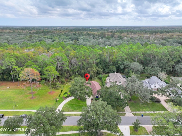 aerial view featuring a view of trees
