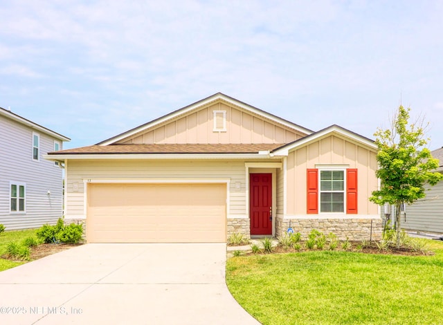 53 Wards Ravine Way, Saint Johns, FL 32259 - view of front of home featuring board and batten siding, concrete driveway, stone siding, and a garage