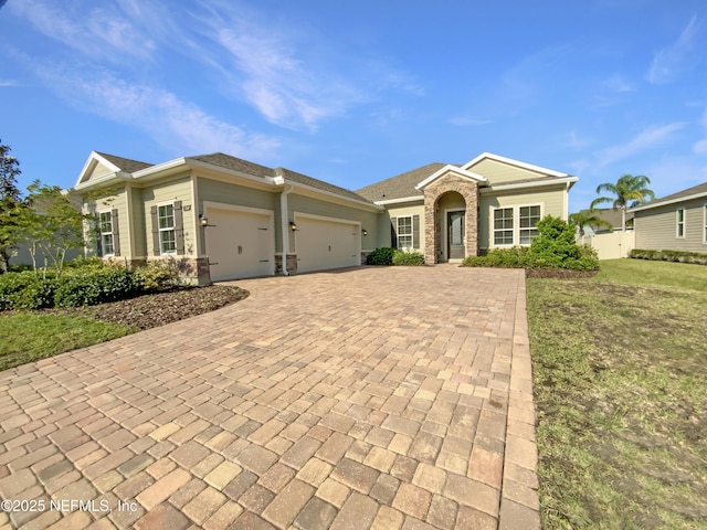 350 Latrobe Ave, Saint Augustine, FL 32095 - view of front of home with an attached garage, fence, and decorative driveway