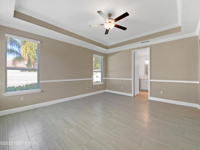 350 Latrobe Ave, Saint Augustine, FL 32095 - spare room featuring a healthy amount of sunlight, a tray ceiling, and visible vents