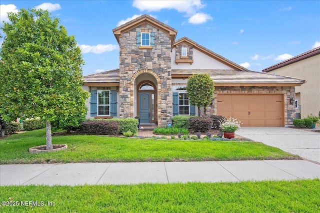 3781 Catania Pl, Jacksonville, FL 32224 - view of front facade with driveway, stone siding, stucco siding, a front lawn, and a garage