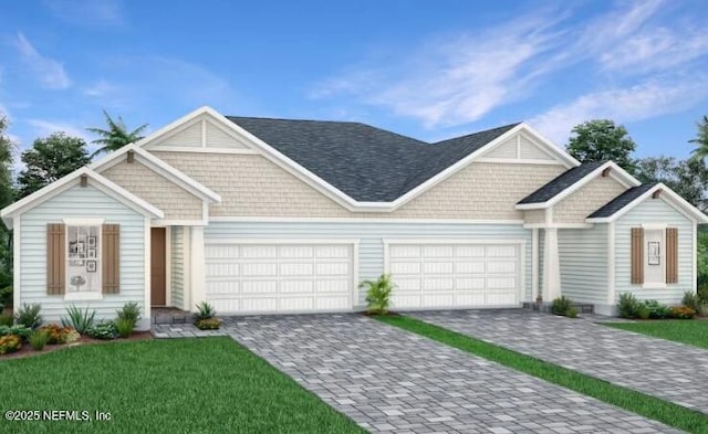 335 Dogleg Run, Saint Johns, FL 32259 - view of front of house with an attached garage, a front lawn, and decorative driveway