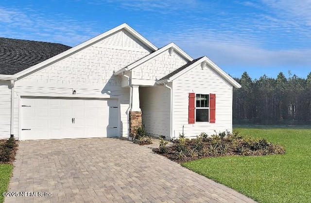 335 Dogleg Run, Saint Johns, FL 32259 - view of front of home featuring a garage, decorative driveway, and a front lawn