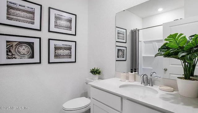335 Dogleg Run, Saint Johns, FL 32259 - full bath with vanity, toilet, a textured wall, and a shower with shower curtain