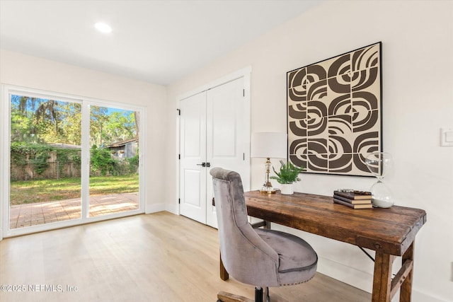 home office with light wood-style flooring, baseboards, and recessed lighting