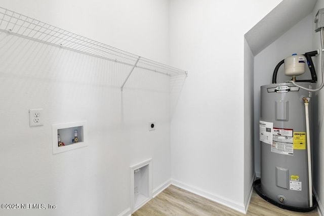 laundry area with hookup for an electric dryer, laundry area, hookup for a washing machine, light wood-style flooring, and electric water heater