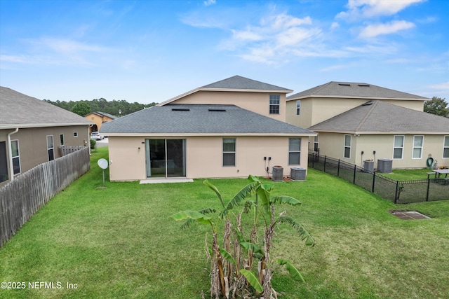 104 Nunna Rock Trl, Saint Augustine, FL 32092 - rear view of house featuring central AC unit, a shingled roof, and stucco siding